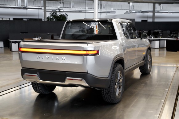 FILE - This Nov. 14, 2018, file photo shows a Rivian R1T at Rivian headquarters in Plymouth, Mich. Shares in Rivian Automotive are set to trade publicly on Wednesday, Nov. 10, 2021, and the world shou ...