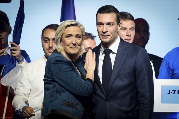 Leader of the French far-right National Rally Marine Le Pen, left and lead candidate of the party for the upcoming European election Jordan Bardella during a political meeting Sunday, June 2, 2024 in  ...