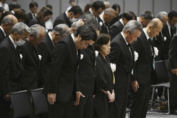 Nagasaki Mayor Shiro Suzuki, right, with other attendees takes a moment of silence during a ceremony to mark the 78th anniversary of the atomic bombing in Nagasaki, southern Japan Wednesday, Aug. 9, 2 ...