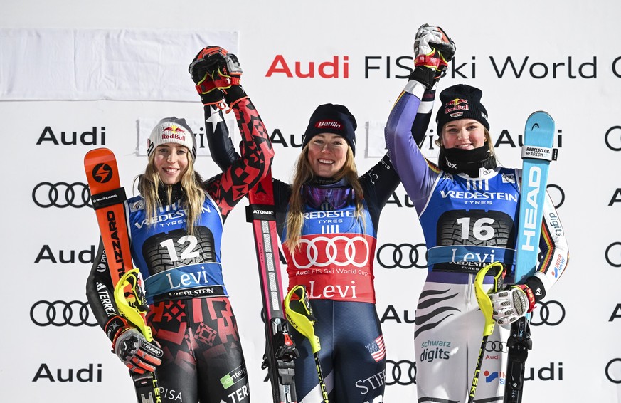 epa12527703 (L-R) Second placed Lara Colturi of Albania, winner Mikaela Shiffrin of USA and third placed Emma Aicher of Germany celebrate on the podium of the Women&#039;s Slalom race at the FIS Alpin ...