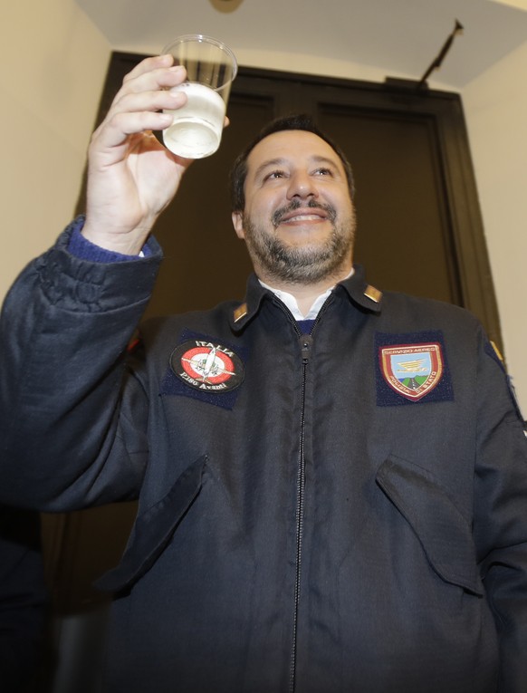 Italy&#039;s Interior Minister Matteo Salvini greet the journalists with a toast, in Milan, Italy, Wednesday, Dec. 19, 2018. (AP Photo/Luca Bruno)