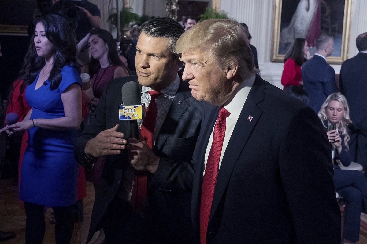 FILE - President Donald Trump, right, appears on "Fox &amp; Friends" with co-host Pete Hegseth in the East Room of the White House in Washington, April 6, 2017. (AP Photo/Andrew Harnik, File ...