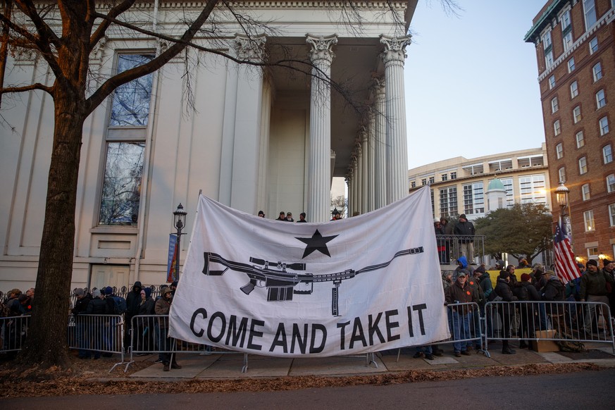 epa08144487 Gun-rights supporters gather for a rally outside the Virginia state capitol in Richmond, Virginia, USA, 20 January 2020. Virginia Citizens Defense League organized the rally to lobby again ...