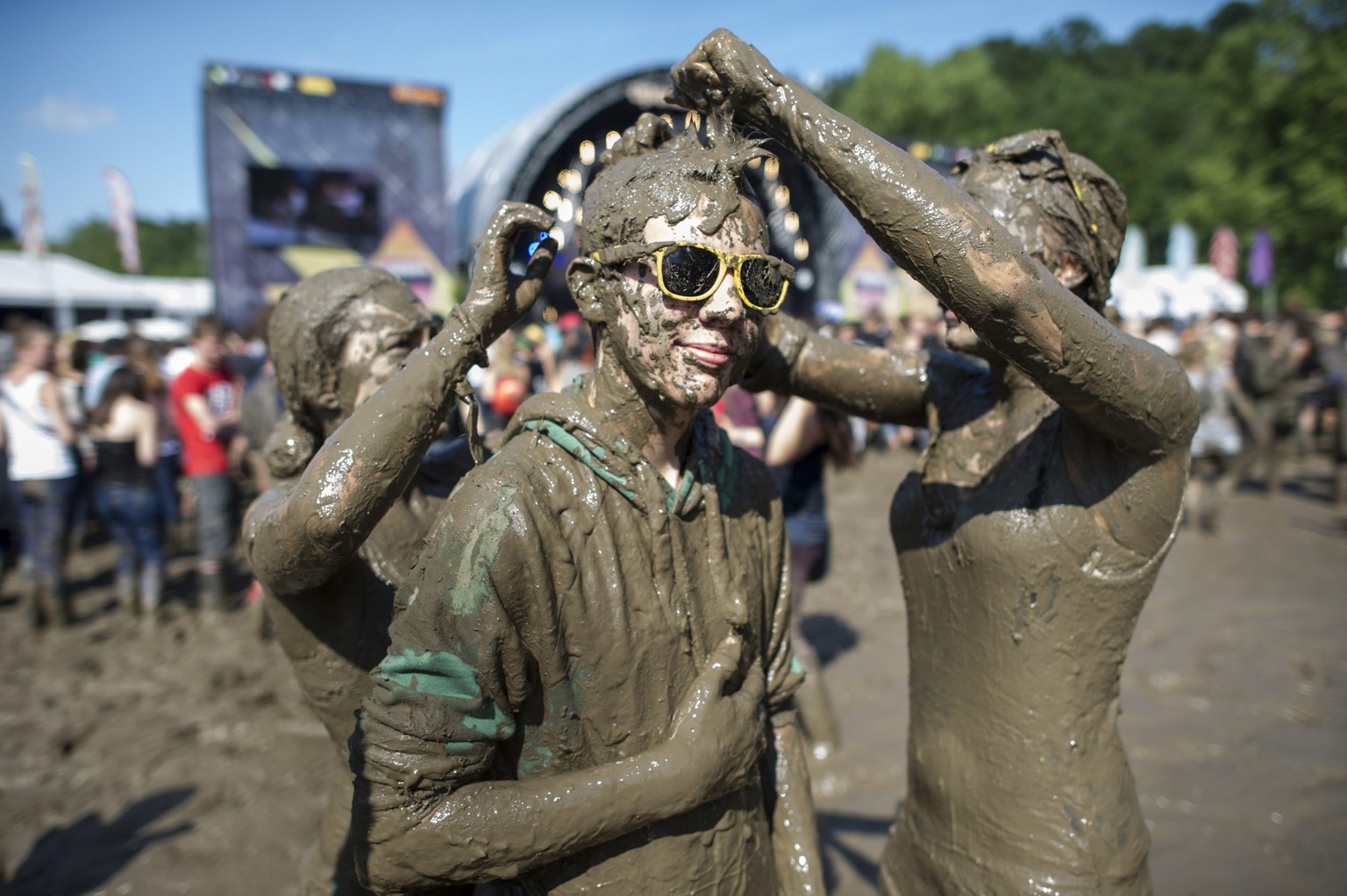 Festivalvisitors dancing in the mud during the OpenAir St. Gallen on Sunday, June 30, 2013, in St. Gallen. The OpenAir St.Gallen is one of the oldest outdoor festivals in Switzerland. It�s close to th ...
