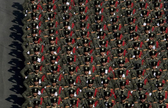 In this photo released by an official website of the Iranian supreme leader's office, Iranian army cadets parade in front of supreme leader Ayatollah Ali Khamenei, unseen, during a graduation cer ...