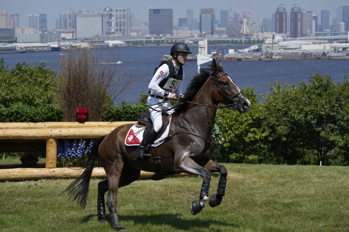 Switzerland's Robin Godel, riding Jet Set, competes during the Equestrian Eventing Cross Country competition at the Sea Forest Cross Country Course during the 2020 Summer Olympics, Sunday, Aug. 1 ...