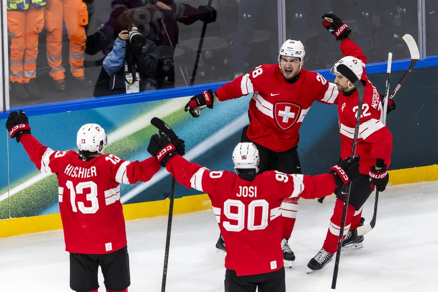 Switzerland's Timo Meier #28 celebrates his goal with teammates Switzerland's Nico Hischier #13, Switzerland's Roman Josi #90, and Switzerland's Nino Niederreiter #22 after scoring ...