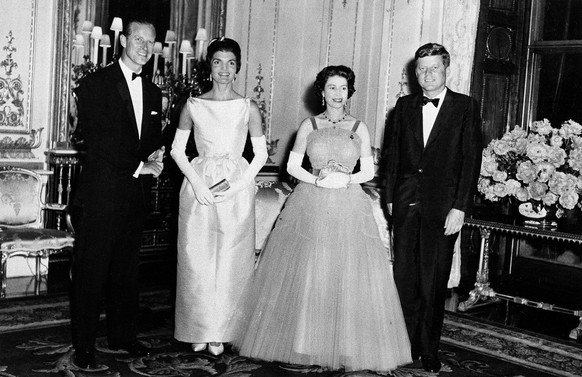 Queen Elizabeth II poses with President John Kennedy, first lady Jacqueline Kennedy, and Prince Philip, June 5, 1961, at Buckingham Palace in London. The Kennedys were guests of the Queen at dinner. ( ...