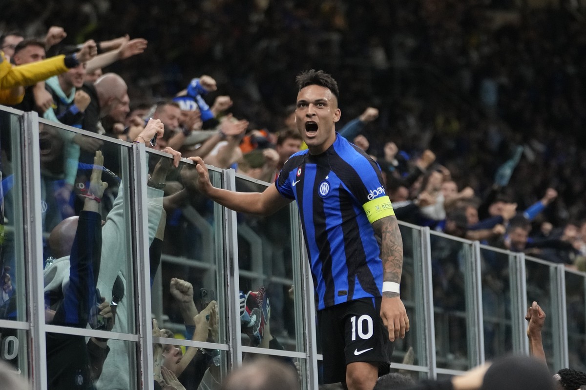 Inter Milan's Lautaro Martinez celebrates after scoring his side's opening goal during the Champions League semifinal second leg soccer match between Inter Milan and AC Milan at the San Siro ...