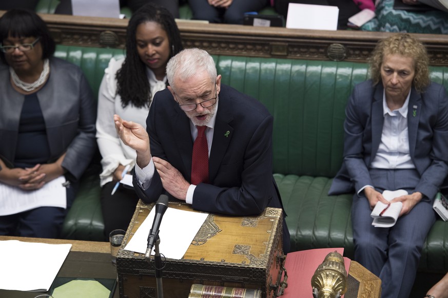 epa07573306 A handout photo made available by the UK Parliament shows Labour leader Jeremy Corbyn (C) speaking during the Prime Minister&#039;s Questions in the House of Commons in Westminster, centra ...