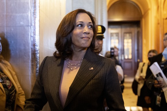 epa10110699 US Vice President Kamala Harris walks from the Senate chamber after the Senate passed the Inflation Reduction Act during a marathon voting session known as a &#039;vote-a-rama&#039;, on Ca ...