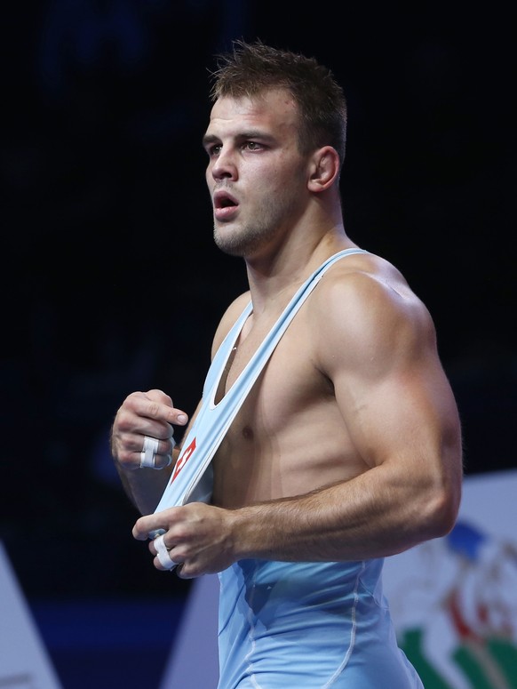 Stefan Reichmuth, of Switzerland, celebrates his victory over Carlos Arturo Izquierdo Mendez, of Columbia, in their bronze match of the men&#039;s 86 kg category during the Wrestling World Championshi ...