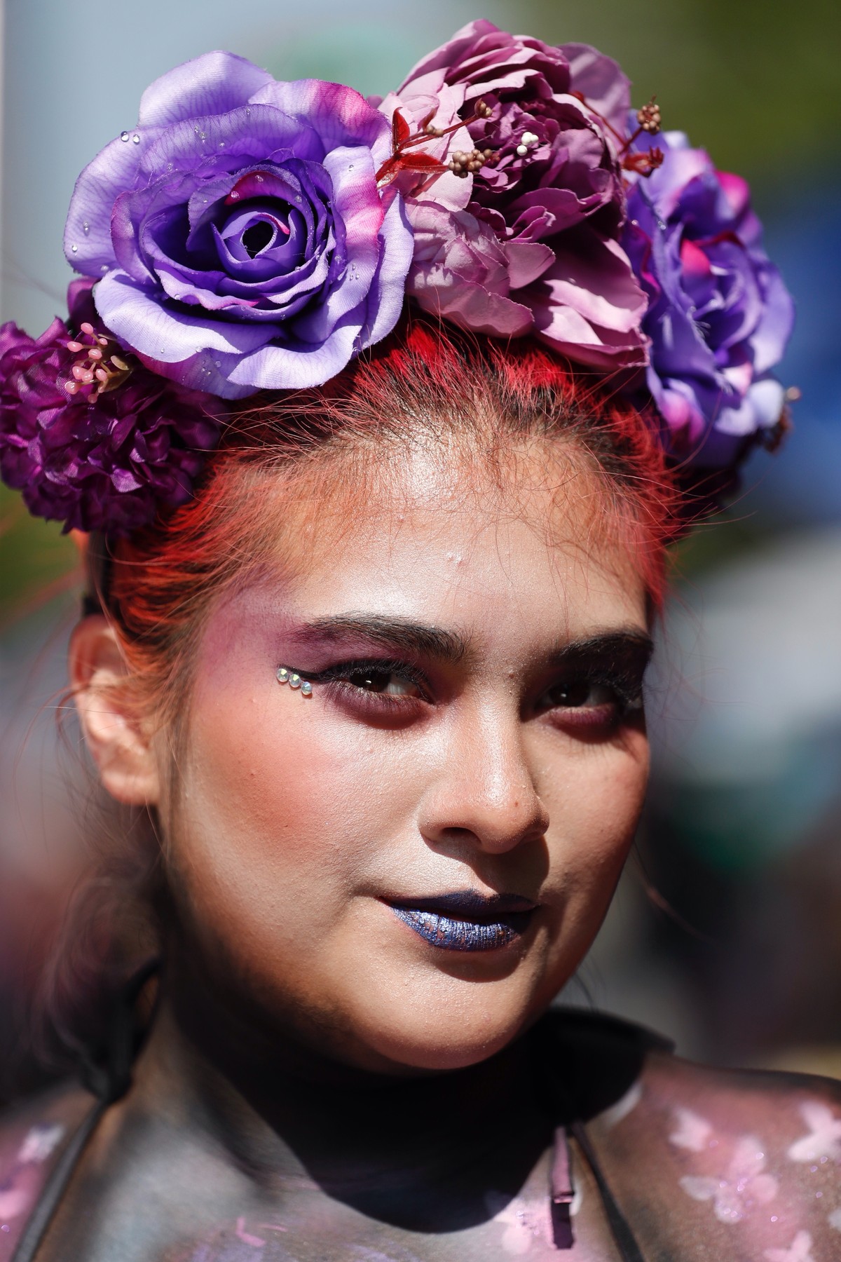 epa11208306 A woman participates in a march on the occasion of International Women's Day in Mexico City, Mexico, 08 March 2024. Tens of thousands of women marched through the streets of Mexico Ci ...