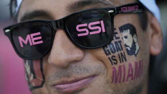FILE - A man wears temporary tattoos supporting Lionel Messi as fans wait for gates to open for Inter Miami&#039;s Leagues Cup soccer match against Orlando City, Wednesday, Aug. 2, 2023, in Fort Laude ...