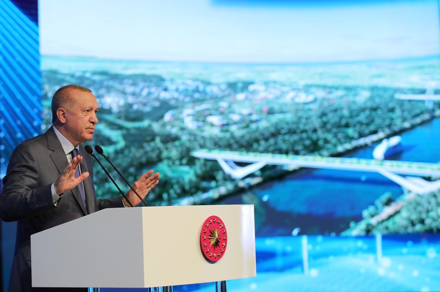 epa09303400 A handout photo made available by the Turkish President Press office shows Turkish President Recep Tayyip Erdogan speaking during the Istanbul Canal Bridge groundbreaking ceremony in Istan ...