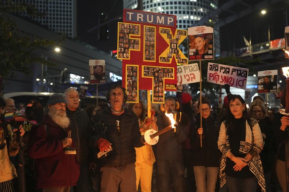 Relatives of hostages, held by Hamas in the Gaza Strip, protest outside of Israel&#039;s Ministry of Defense in Tel Aviv, Israel, Monday, Feb. 10, 2025, after the militant group announced it would del ...