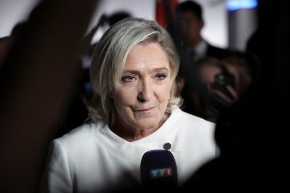 epaselect epa11465845 Member of Parliament for the French right-wing party National Rally (Rassemblement National, RN), Marine Le Pen addresses journalists at the party&#039;s headquarters after preli ...