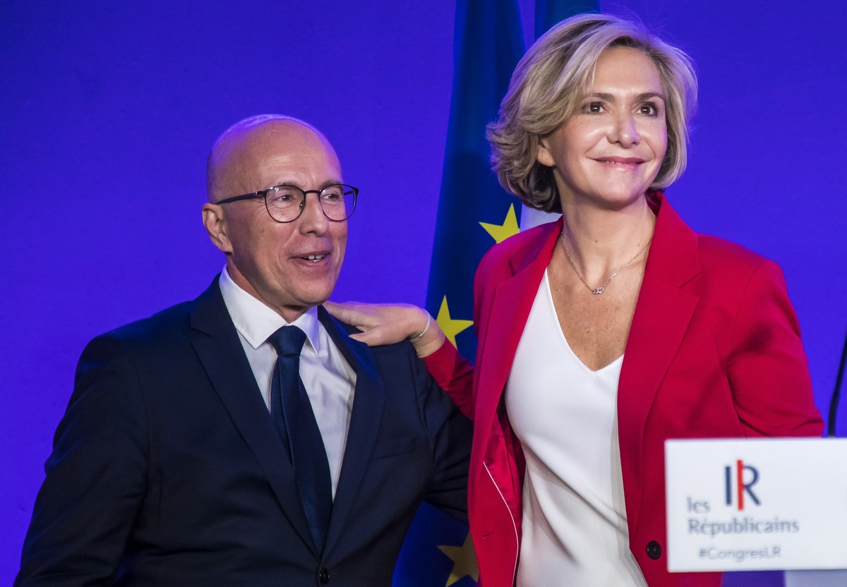 epa09621217 Paris' Ile de France region president and winner of the right-wing party 'Les Republicains' primaries for 2022 French presidential election Valerie Pecresse flanked by Party ...