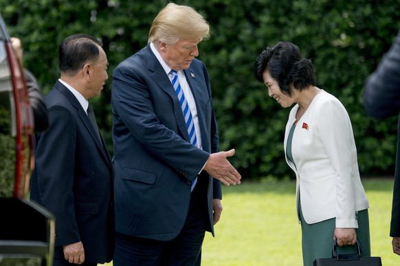 President Donald Trump, center, accompanied by former North Korean military intelligence chief Kim Yong Chol, left, greets Kim Song Hye, Head of the Committee for the Peaceful Reunification of Korea o ...