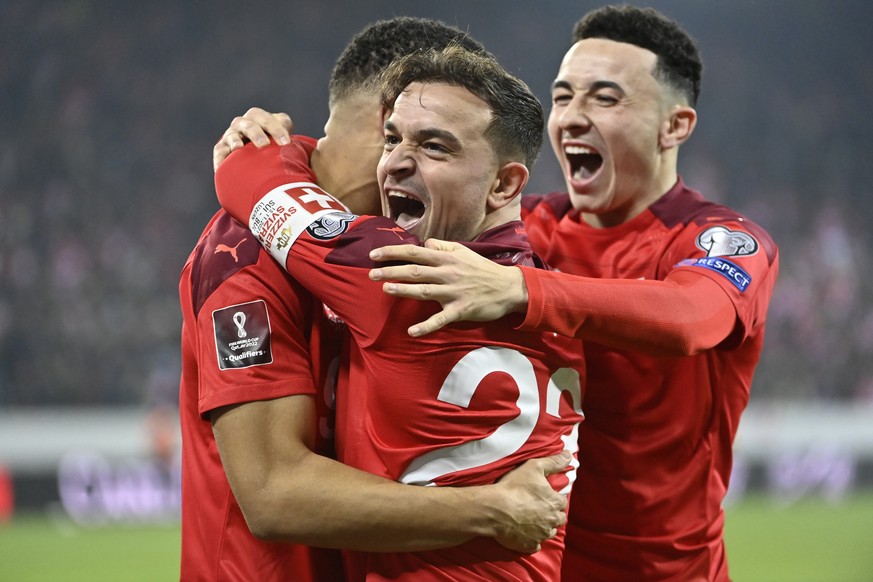 From left, Switzerland&#039;s forward Noah Okafor, Switzerland&#039;s midfielder Xherdan Shaqiri and Switzerland&#039;s midfielder Ruben Vargas celebrate the 1 - 0 goal during the 2022 FIFA World Cup  ...