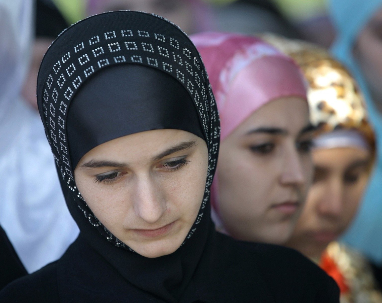 ** ADVANCE FOR USE SUNDAY, MARCH 6, 2011 AND THEREAFTER ** FILE - In this Sept. 16, 2010 file photo, Chechen students from an Islamic university wear head scarves during an event in downtown Grozny, t ...