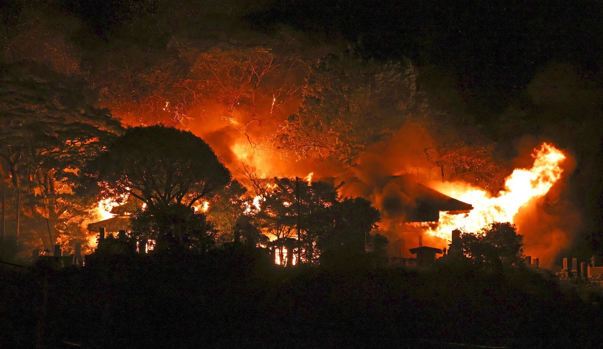 Smoke rises over buildings after a fire in Oita, southern Japan, Wednesday, Nov. 19, 2025. (Kyodo News via AP)
Japan Fire