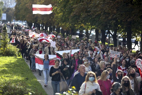 Women with old Belarusian national flags march during an opposition rally to protest the official presidential election results in Minsk, Belarus, Saturday, Sept. 19, 2020. Daily protests calling for  ...