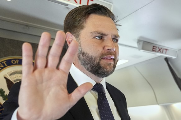 Vice President JD Vance talks to reporters on board Air Force Two at Leonardo da Vinci International Airport, in Rome, Monday, May 19, 2025, after attending the inauguration of Pope Leo XIV at the Vat ...