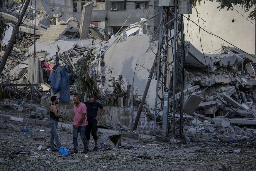 epa10920599 Destroyed houses seen following Israeli strikes in the Gaza strip, 15 October 2023. The Israel Defense Force (IDF) on 14 October announced they are increasing readiness and preparing to &# ...