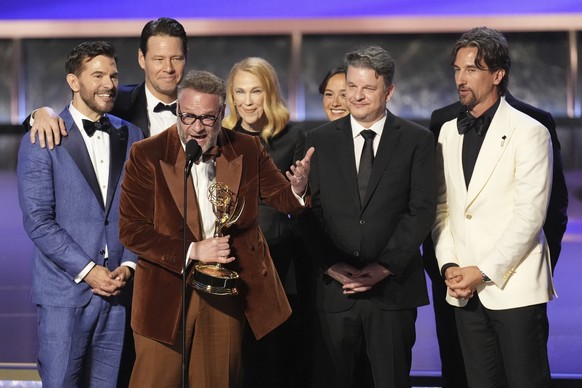 Seth Rogen, center, and the team from &quot;The Studio&quot; accept the award for outstanding comedy series during the 77th Primetime Emmy Awards on Sunday, Sept. 14, 2025, at the Peacock Theater in L ...