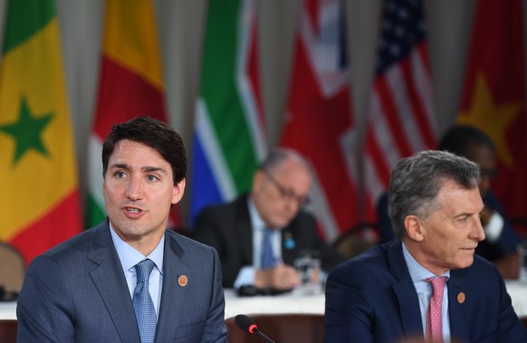 epa06796886 Canada&#039;s Prime Minister Justin Trudeau (L) and Argentina&#039;s President Mauricio Macri (R) attend the G7 and Outreach Working Session at the G7 summit in Charlevoix in Canada 09 Jun ...