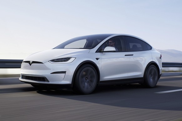 This photo provided by Tesla shows the 2022 Model X, a three-row electric SUV famous for its falcon-wing doors and available used at bargain prices. (Courtesy of Tesla via AP)
Behind The Wheel