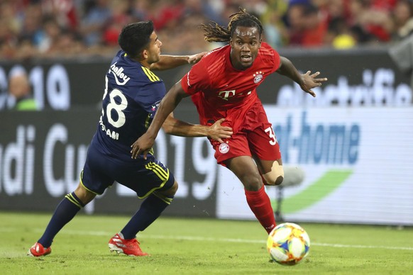 Bayern's Renato Sanches, right, and Fenerbahce's Murat Saglam challenge for the ball during the friendly soccer Audi Cup match between FC Bayern Munich and Fenerbahce Istanbul at the Allianz Arena sta ...