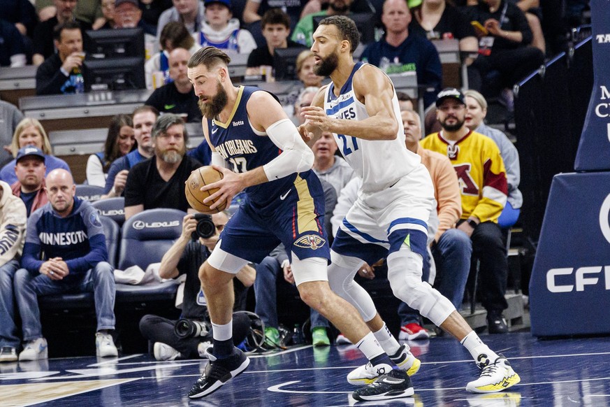 Jonas Valanciunas 17 of the New Orleans Pelicans disputes the ball with Rudy Gobert 27 of the Minnesota Timberwolves during the second half of an NBA, Basketball Herren, USA basketball game between th ...
