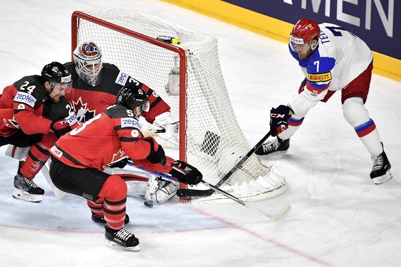 epa05976325 Russia&#039;s forward Ivan Telegin (R) in action during the 2017 IIHF Ice Hockey World Championship semifinal match between Canada and Russia in Cologne, Germany, 20 May 2017. EPA/SASCHA S ...