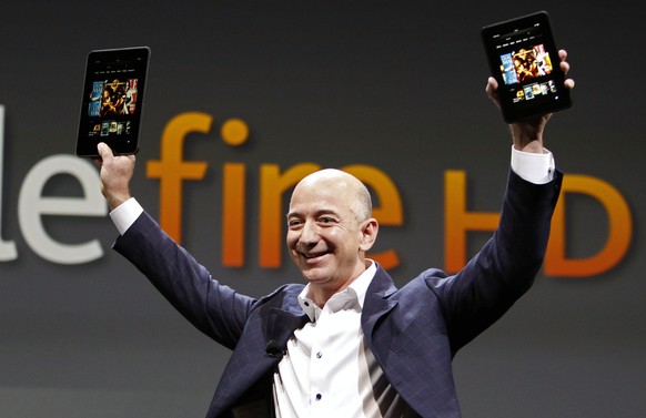 FILE - In this Sept. 6, 2012 file photo, Jeff Bezos, CEO and founder of Amazon, introduces the Amazon Kindle Fire during an event in Santa Monica, Calif. Amazon, the corporate juggernaut that started ...