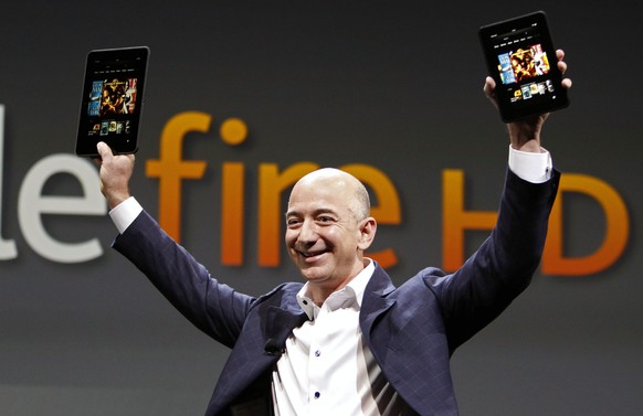 FILE - In this Sept. 6, 2012 file photo, Jeff Bezos, CEO and founder of Amazon, introduces the Amazon Kindle Fire during an event in Santa Monica, Calif. Amazon, the corporate juggernaut that started  ...