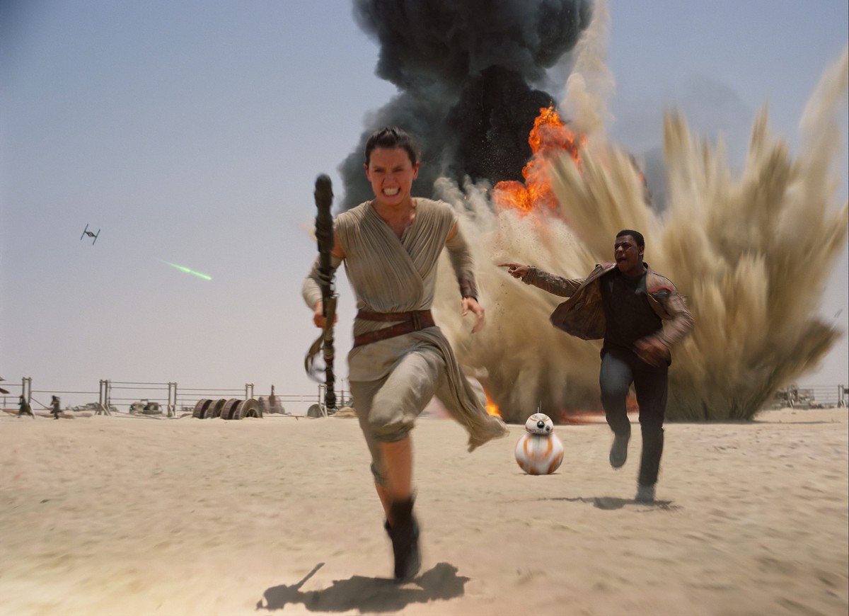 This photo provided by Disney shows Daisey Ridley as Rey, left, and John Boyega as Finn, in a scene from the new film, "Star Wars: The Force Awakens." Daniel Fleetwood, a 31-year-old Texan w ...