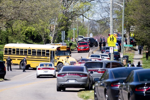 Police work in the area of Austin-East Magnet High School after a reported shooting Monday, April 12, 2021. Authorities say multiple people including a police officer have been shot at the school. (Br ...