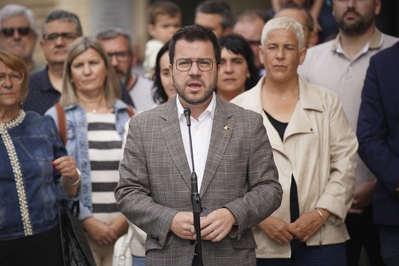 Catalonia's regional President and candidate for ERC ( Republican Left of Catalonia ) Pere Aragones talks to journalists after voting at a polling station in Pineda de Mar, north of Barcelona, Su ...