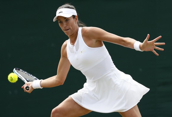 Spain&#039;s Garbine Muguruza returns to Romania&#039;s Sorana Cirstea during their Women&#039;s Singles Match on day six at the Wimbledon Tennis Championships in London Saturday, July 8, 2017. (AP Ph ...