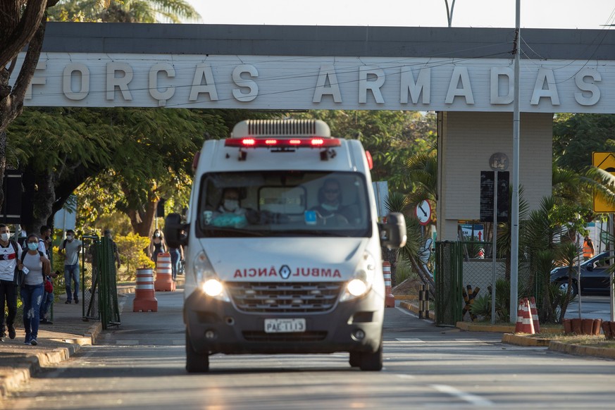 epa09344887 An ambulance leaves the Hospital of the Armed Forces (HFA) with the President of Brazil, Jair Bolsonaro, to transport him to the Military Air Base of Brasilia, Brazil, 14 July 2021. Bolson ...