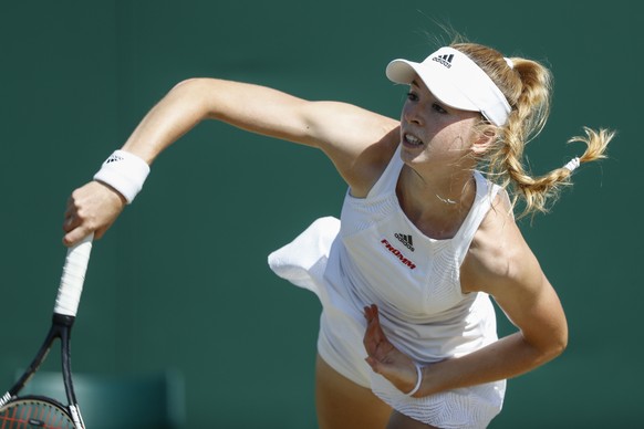 Simona Waltert of Switzerland in action during her first round girls&#039; singles match against Yuki Naito of Japan at the Wimbledon Championships at the All England Lawn Tennis Club, in London, Brit ...