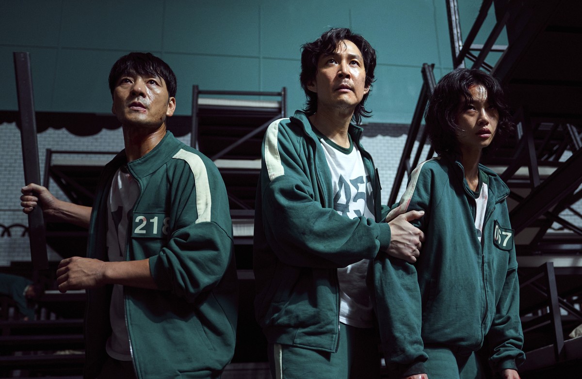 This undated photo released by Netflix shows South Korean cast members, from left, Park Hae-soo, Lee Jung-jae and Jung Ho-yeon in a scene from "Squid Game." Squid Game, a globally popular So ...