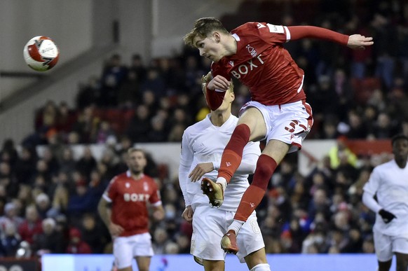 Nottingham Forest&#039;s James Garner heads the ball in front of Arsenal&#039;s Martin Odegaard during the English FA Cup third round soccer match between Nottingham Forest and Arsenal at the City Gro ...