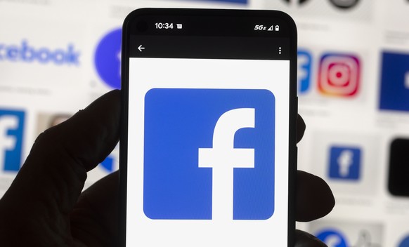 FILE - The Facebook logo is seen on a mobile phone, Oct. 14, 2022, in Boston. The seeds of misinformation about next week&#039;s 2022 midterm elections were planted in 2020. That&#039;s when baseless  ...