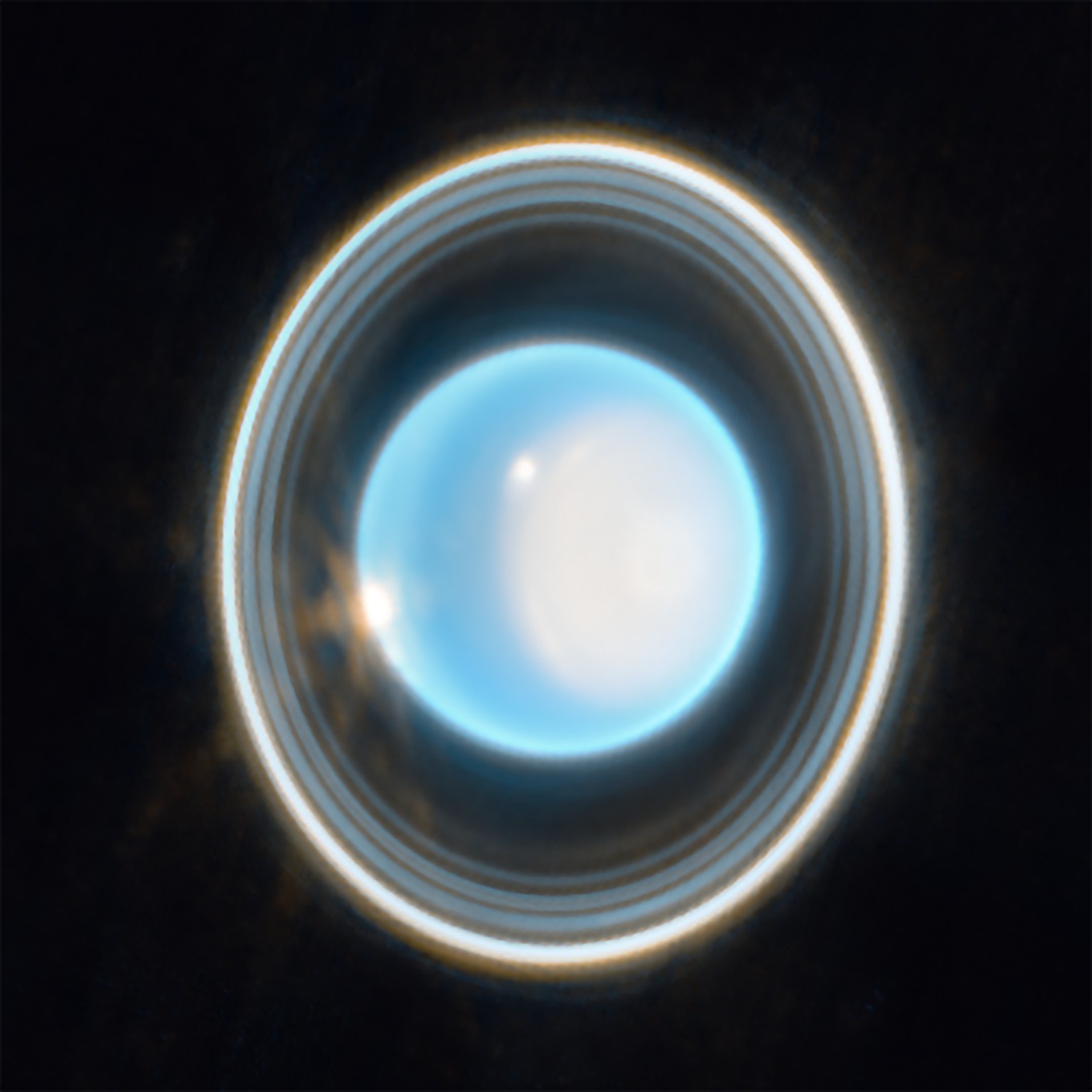 This zoomed-in image of Uranus, captured by Webb's Near-Infrared Camera (NIRCam) Feb. 6, 2023, reveals stunning views of the planet's rings. The planet displays a blue hue in this representa ...