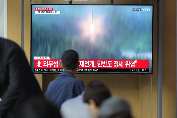 FILE - A TV screen showing a news program reporting about North Korea&#039;s missile launch with file footage, is seen at the Seoul Railway Station in Seoul, South Korea on Oct. 6, 2022. The nuclear-p ...