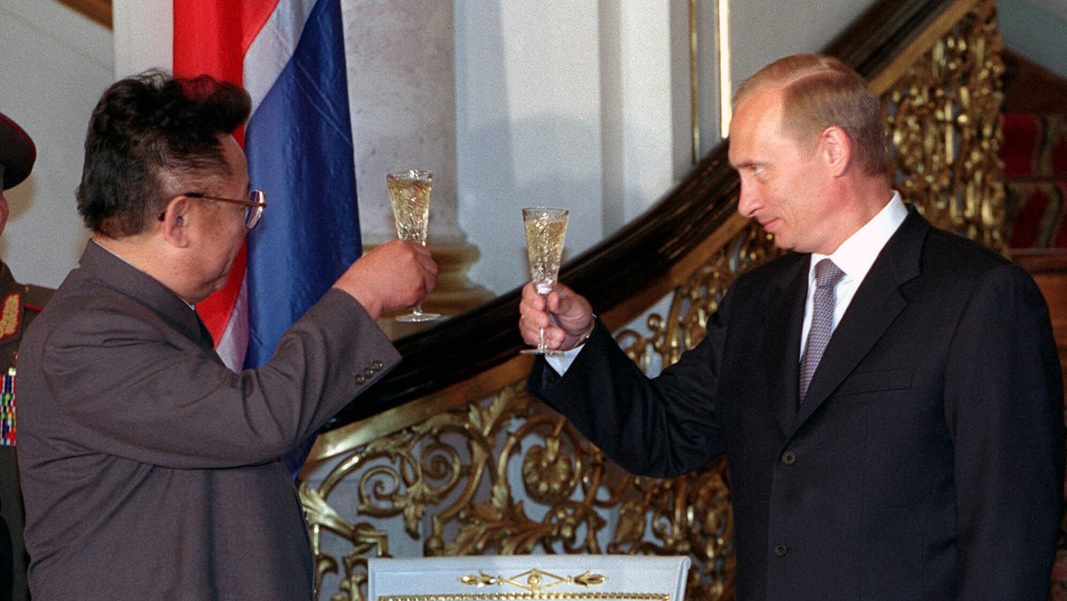 FILE - In this file Saturday, Aug. 4, 2001 file photo, Russian President Vladimir Putin, right, clinks glasses with North Korean leader Kim Jong Il during their meeting at the Kremlin in Moscow, Russi ...