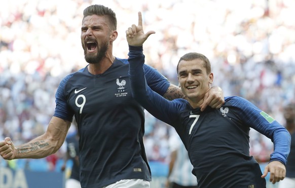 epa06851797 Antoine Griezmann of France celebrates with team mate Olivier Giroud (L) after scoring the 1-0 lead from the penalty spot during the FIFA World Cup 2018 round of 16 soccer match between Fr ...